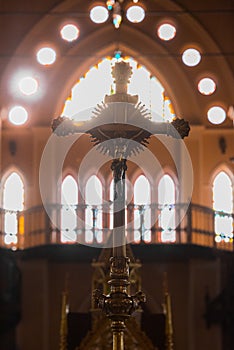 Christian cross Participation in churchesFake flowers on table