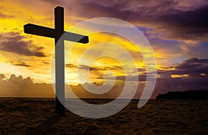 Christian cross on sunset