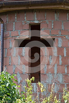 christian cross in a wall