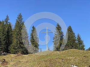 Christian crucifix on the hills and lookouts over the Eigental alpine valley, Einsiedeln - Canton of Schwyz, Eigenthal