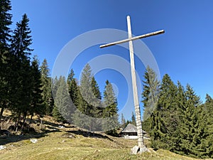 Christian crucifix on the hills and lookouts over the Eigental alpine valley, Einsiedeln - Canton of Schwyz, Eigenthal