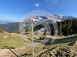 Christian crucifix on the hills and lookouts over the Eigental alpine valley, Einsiedeln - Canton of Schwyz, Eigenthal