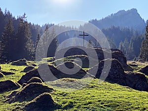 Christian crucifix on the hills and lookouts over the Eigental alpine valley, Einsiedeln - Canton of Schwyz, Eigenthal