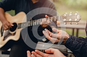 Christian Families Worshiping God Outdoors To relax life honoring God with a melodious guitar playing bible photo