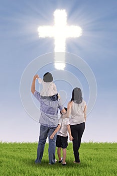 Christian family with a cross