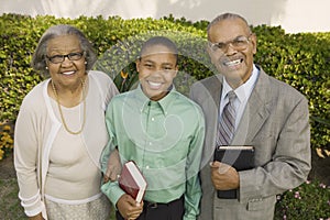 Christian Grandparents and Grandson holding bible