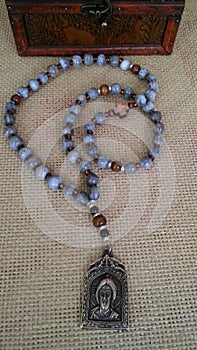 Christian handmade rosary with Jesus Christ metal meadallion photo