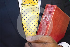 Man is holding the Holy Bible. photo
