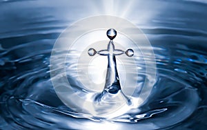 Christian holy water with crucifix cross background. Purity water for ritual photo
