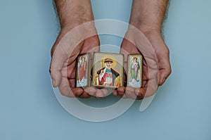 Christian icon of the holy princess Olga and the archangels Gabriel and Michael in their hands
