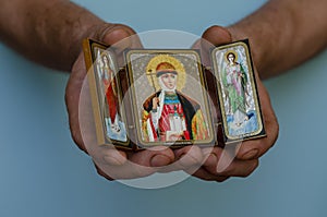 Christian icon of the holy princess Olga and the archangels Gabriel and Michael in their hands