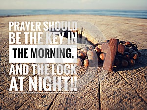 Christian inspirational quote - Prayer should be the key in the morning, and the lock at night. With wooden rosary.