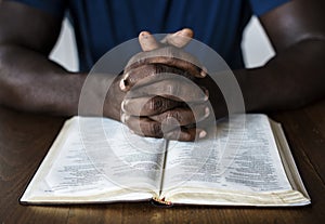 Christian man is reading a bible
