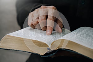 Christian man reading the Holy Bible to praying to God in the sunday morning.spirituality, religion,believe.Christian life.