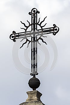 Christian metal cross on sky background.