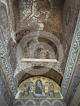 Christian mosaics inside the mosque of Santa Sofia, with a canopy on the upper part that is lowered to hide them during the five