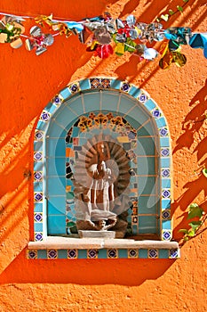 Christian Mural Motif on Orange Wall