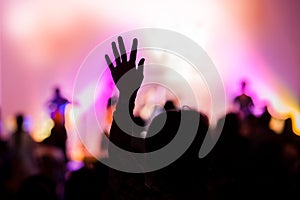 Christian music concert with raised hand