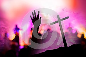 Christian music concert with raised hand