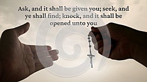 Christian prayer with hand holding Holy Rosary - Ask, and it shall be given you, seek, and ye shall find, knock, and it