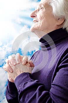 Christian religious senior woman praying
