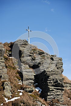 Christian rood on the summit of rock