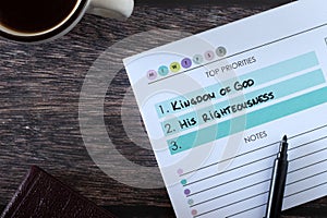Christian top priorities list, seek first kingdom of God and His righteousness, handwritten text in notebook