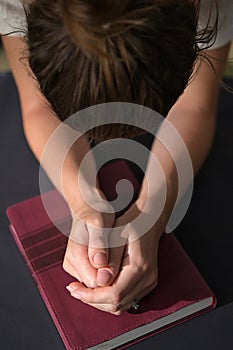 Christian Woman Hands Folded On Holy Bible Are Pray And Worship
