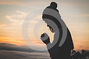 Christian woman hands praying to god Woman Pray for god blessi photo