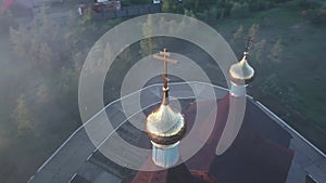 Christian wooden church in the village of Salym in the Urals in the Khanty Mansiysk region. Orthodox church with a bell tower.