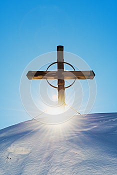 Christianity religious cross on snow capped mountain