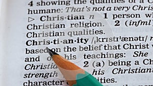 Christianity word definition written in dictionary, one of main religions, faith