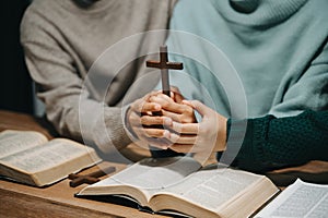 Christians are congregants join hands to pray and seek the blessings of God photo