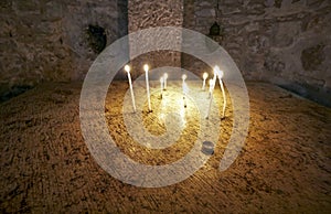 Christians light candles, Church of the Holy Sepulchre - Jerusalem.