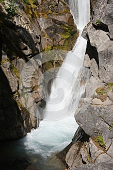 Christine falls surges through a narrow canyon