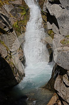 Christine falls surges through a narrow canyon