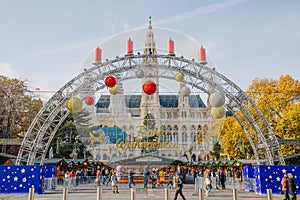 Christkindlmarkt at Rathausplatz, Christmas Market in town hall square in Vienna, Austria. Scene of the market at day with christm