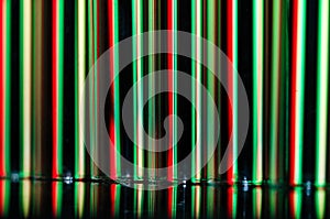 Abstract: Vertical Streaks of Red and Green Light Forming a Holiday Background