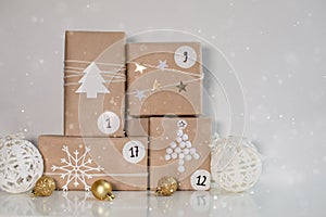 Christmas Advent calendar. Gift boxes with numbers on a light background with snow. DIY and hobbi concept photo