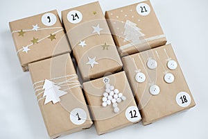 Christmas Advent calendar, gift boxes with numbers on a light background. Winter holidays. DIY and hobbi concept photo