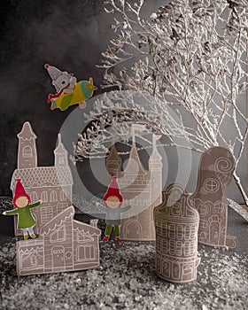 Christmas Advent calendar, paper houses, snow, elf figures. Little Christma