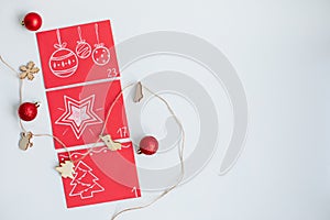 Christmas Advent calendar. Red envelopes with numbers on a light background. DIY and hobbi concept photo