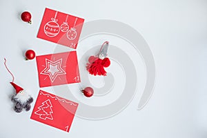 Christmas Advent calendar. Red envelopes with numbers on a light background. DIY and hobbi concept photo