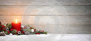 Christmas or Advent wood background with a candle