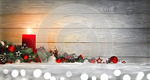 Christmas or Advent wood background with a candle