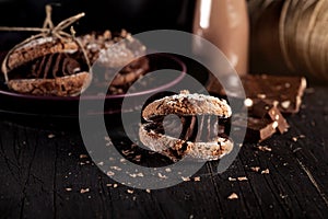 Christmas almond cookies with pieces of chocolate on old wooden