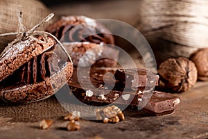 Christmas almond cookies with pieces of chocolate and walnuts on