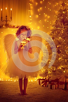 Christmas Angel Child with Wings hold Lighting Candle, Xmas Tree