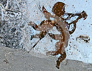 Christmas angels in frozen window