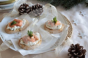 Christmas appetizer, smoked salmon and cream cheese canapés.